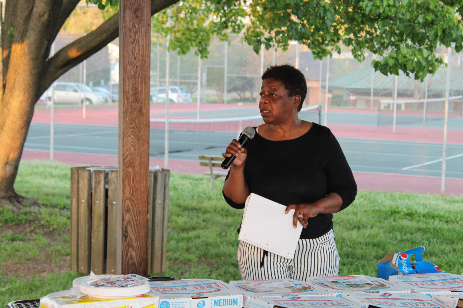 Candlelight vigil inspired by slain rapper remembers local homicide victims